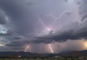 Storm clouds over Las Vegas with debris scattered on the ground.